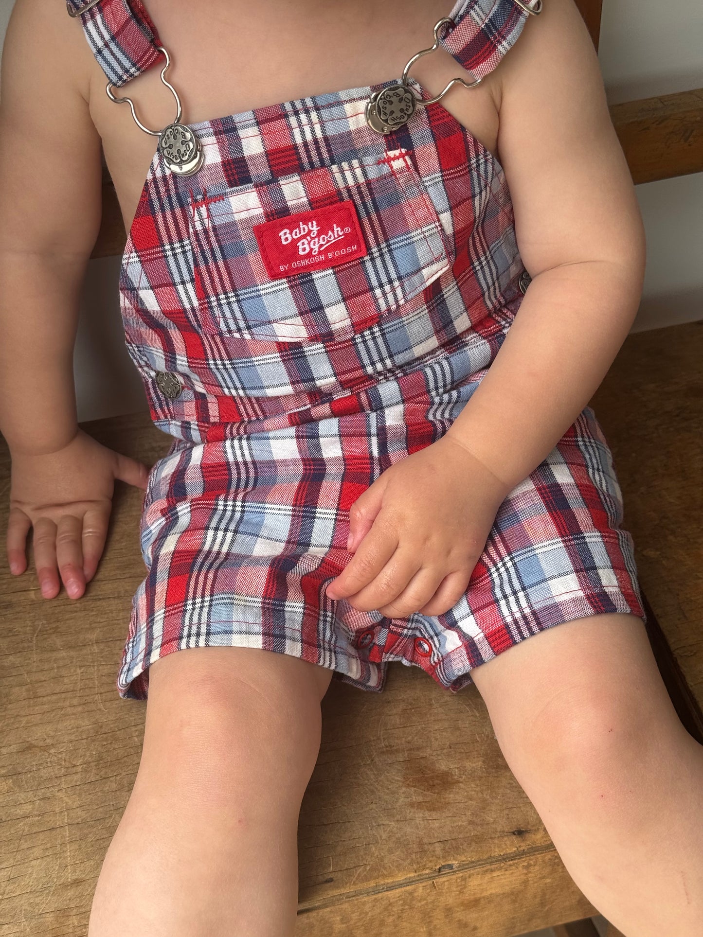 check Oshkosh shortalls - 12m/18m