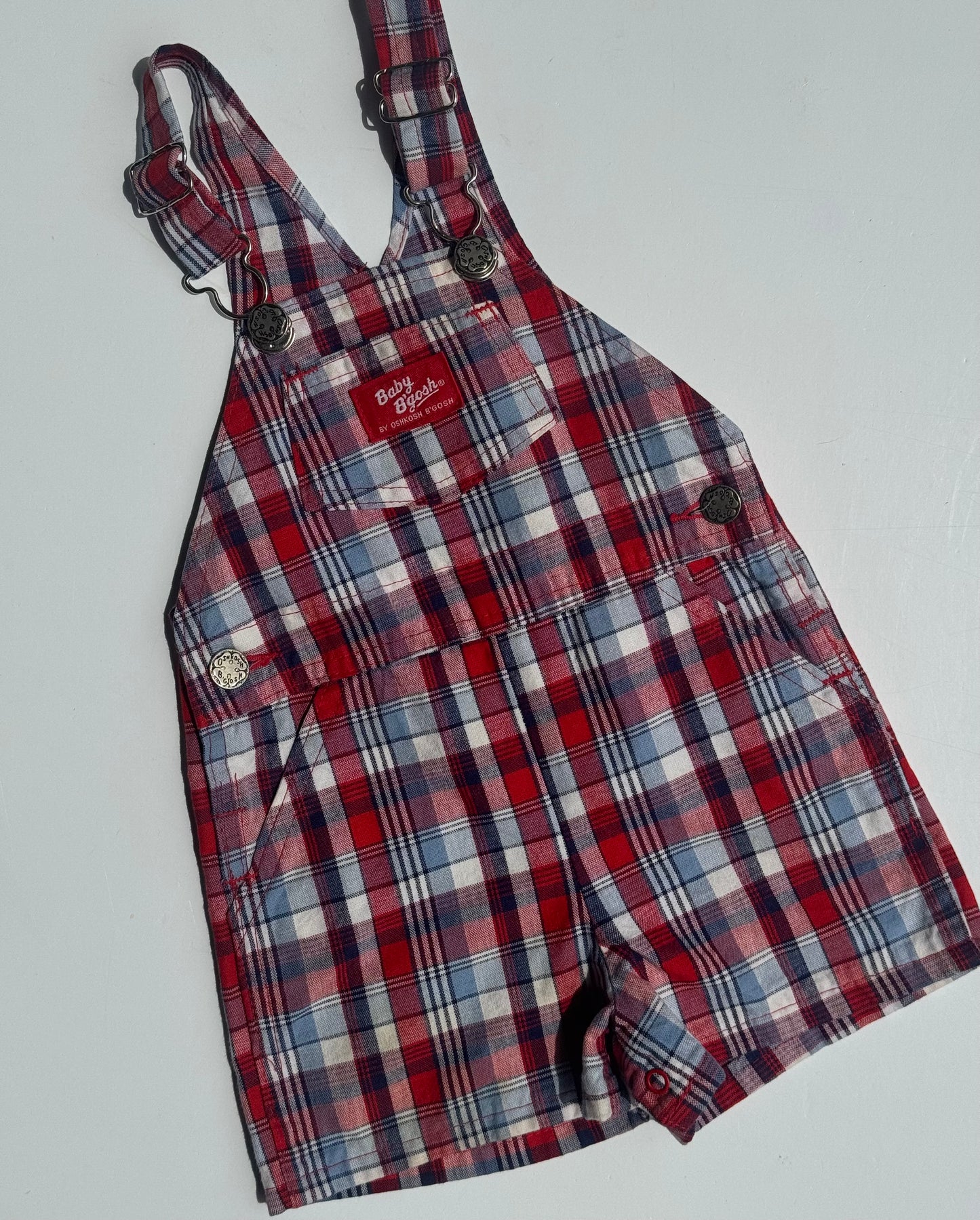 check Oshkosh shortalls - 12m/18m